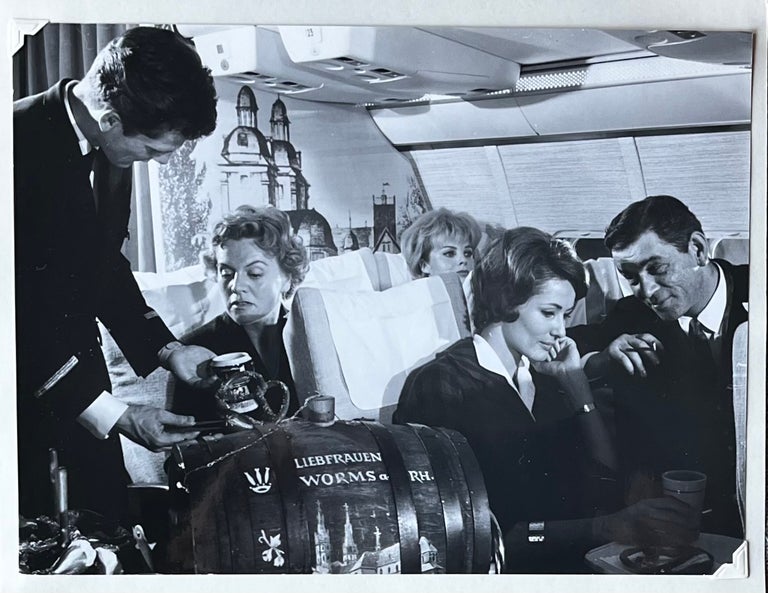 Item #227246 1960s Glossy Black and White Photo of Lufthansa Passengers Enjoying Wine and Beer en Route. Lufthansa Airlines.