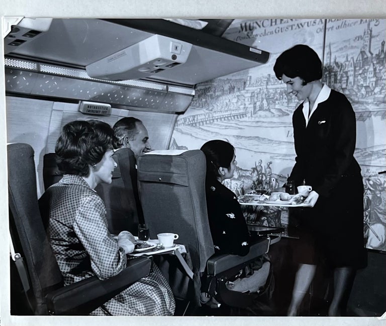 Item #227247 1960s Glossy Black and White Photo of Lufthansa Passengers Enjoying Dinner en Route. Lufthansa Airlines.