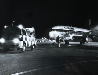 Item #227252 1970s Glossy Black and White Photo of a Lufthansa Boeing 737 "City Jet" at Night....